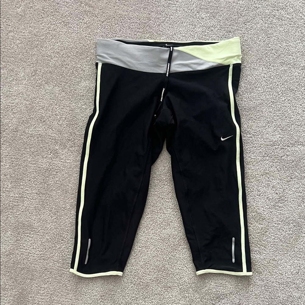 Nike women’s Black and Gray Leggings with Yellow Accents